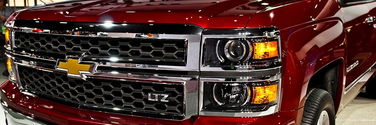 Red Chevy Silverado with Smoked Headlights