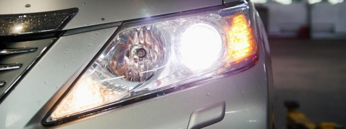 Car with the projector headlights and low beams turned on