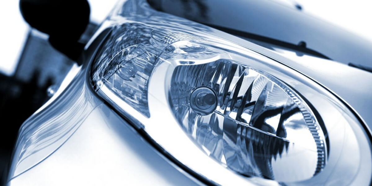 Gray vehicle equipped with factory reflector headlights
